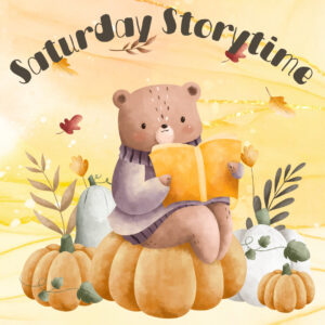 Cute cartoon of a bear sitting on pumpkins reading a book