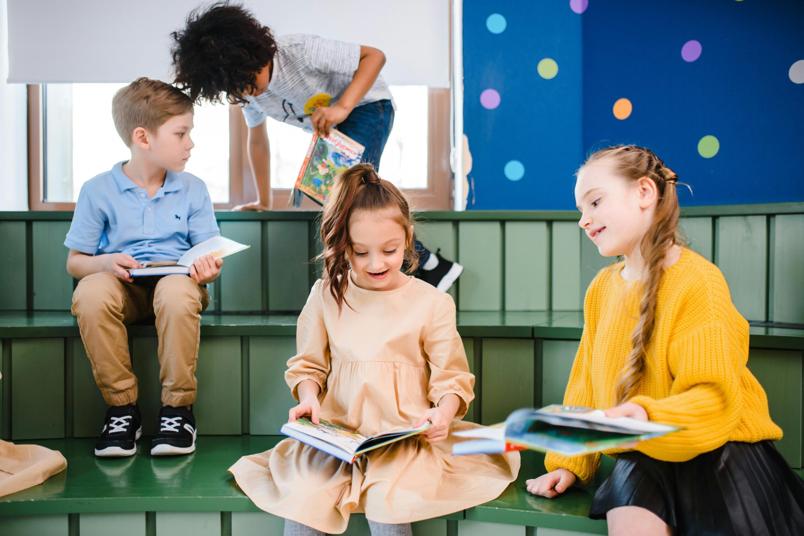 Kids reading books in a library